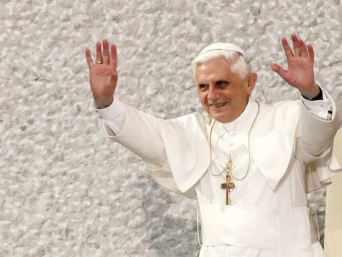 Pope Benedict XVI greets the crowd during "Many Hearts for the pope, messenger of peace" meeting at the Vatican on June 28, 2004. Photo courtesy of REUTERS/Alessandro Bianchi 