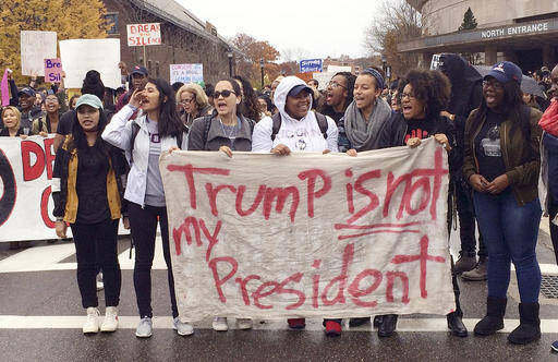 People protest on the University of Connecticut campus against the election of Republican Donald Trump as President Wednesday, Nov. 9, 2016, in Storrs, Conn. (AP Photo/Pat Eaton-Robb)