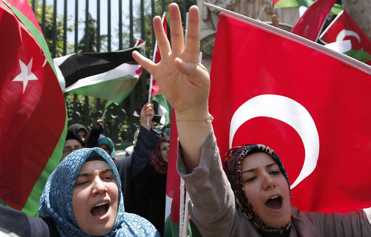 Turkish women shout slogans during a protest in Istanbul against the Israeli air attacks on Gaza July 10.
