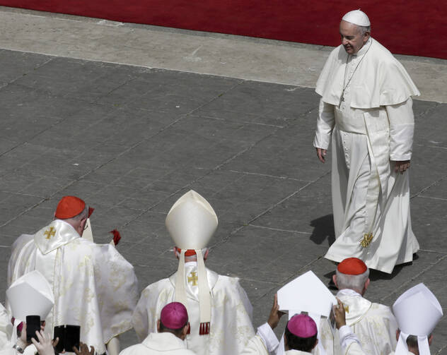 Pope Francis walks towards cardinals at the end of a Mass for the the Holy Year of Mercy, in St. Peter's Square at the Vatican, Sunday, April 3, 2016. (AP Photo/Alessandra Tarantino)