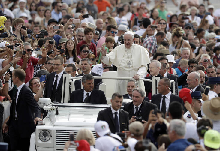 Pope Francis waves to faithful as he is driven through the crowd ahead of his weekly general audience, in St. Peter's Square, at the Vatican, Wednesday, Aug. 31, 2016. (AP Photo/Andrew Medichini)