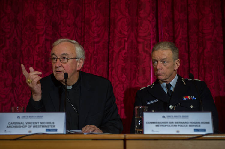 Cardinal Vincent Nichols of Westminster speaks during a human trafficking conference in London, Dec. 6, 2014. 