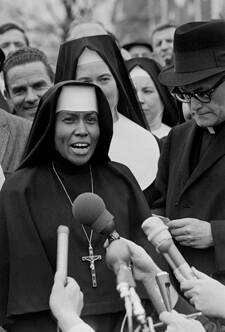 Sister Mary Antona Ebo, of the Sisters of St. Mary in St. Louis, talks to the media about black voting rights during a civil rights protest in Selma, Ala., on March 10, 1965.