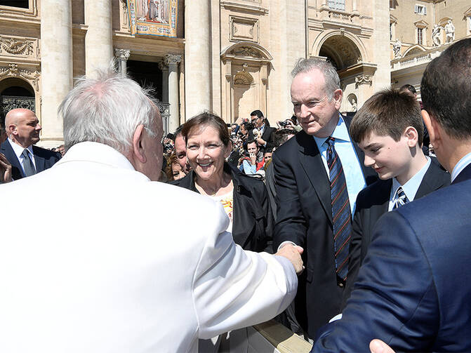 Fox News Channel host Bill O'Reilly, right, shakes hands with Pope Francis during the Wednesday general audience in St. Peter's Square at the Vatican, on April 19, 2017. Photo courtesy of Osservatore Romano/Handout via Reuters