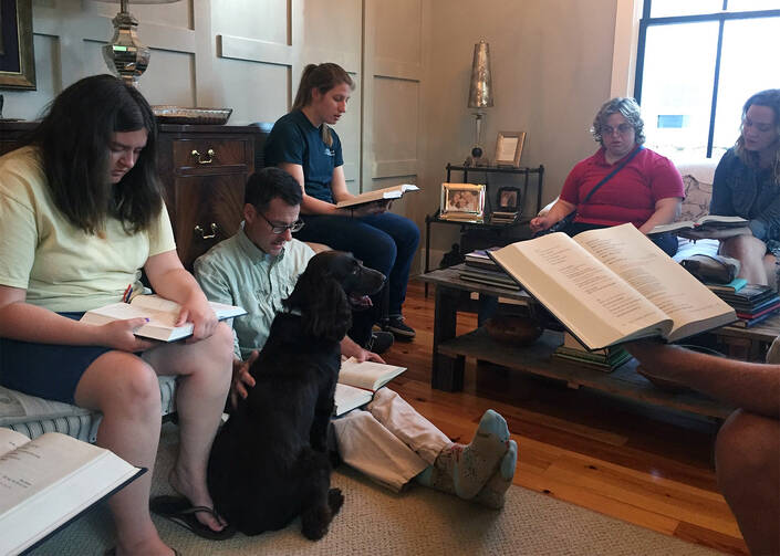 A prayer gathering at Friendship House in Fayetteville