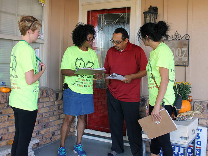 Connie Johnson, center, chairwoman of the Oklahoma Coalition to Abolish the Death Penalty, campaigns against the death penalty in an Oklahoma City neighborhood on Oct. 16, 2016. RNS photo by Bobby Ross Jr.