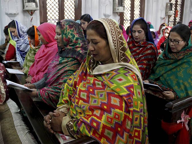 Christian women worship together at a Mass at All Saints Church in Peshawar, Pakistan, on Dec. 25, 2015. Photo courtesy of Reuters/Khuram Parvez