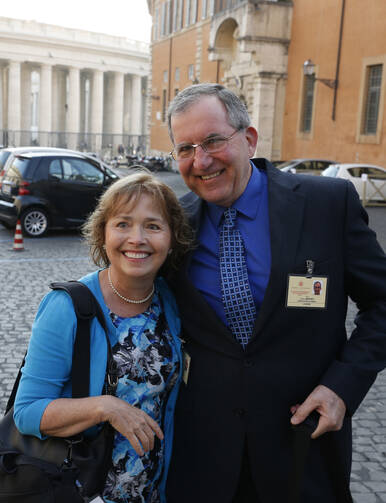 Alice and Jeff Heinzen of Menomonie, Wis., pose for a photo as they arrive for the morning session of the extraordinary Synod of Bishops on the family at the Vatican Oct. 7. The couple are auditors at the synod. (CNS photo/Paul Haring)