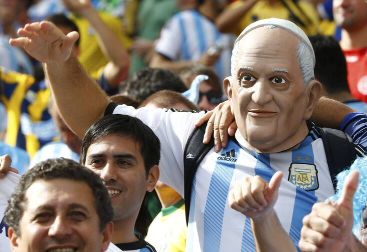 An Argentina fan wears a mask of Pope Francis as he attends the 2014 World Cup Group F final June 25, 2014, between Argentina and Nigeria at the Beira Rio stadium in Porto Alegre, Brazil. (CNS photo/Stefano Rellandini, Reuters) 