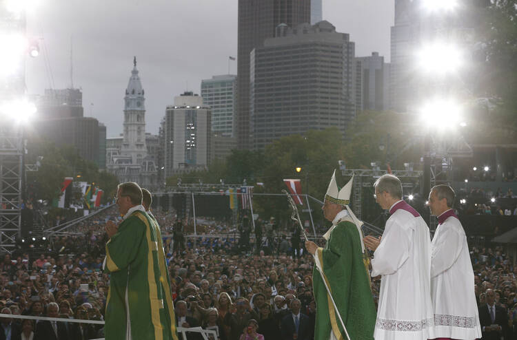 Pope Francis leaves in procession after celebrating the closing Mass of the World Meeting of Families on Benjamin Franklin Parkway in Philadelphia, Sept. 27 (CNS photo/Paul Haring).