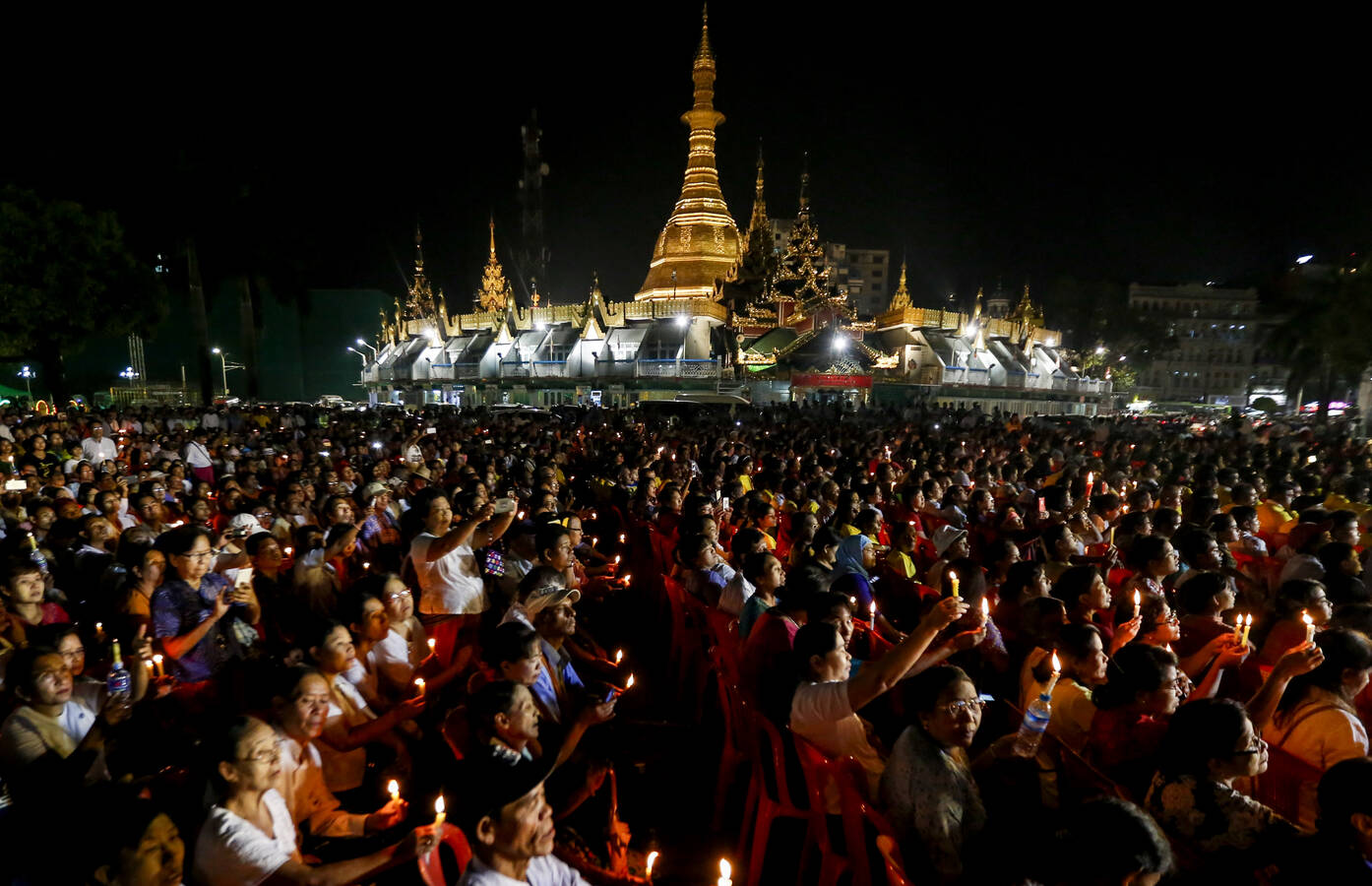 People hold candles during an Interreligious Gathering of Prayer for Peace in Yangon, Myanmar, Oct. 31 (CNS photo/Lynn Bo Bo, EPA).
