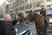 A priest blesses a New York City police officer's horse on the feast of St. Francis of Assisi, patron saint of animals. (CNS photo/Octavio Duran)