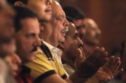 Christians pray during Coptic Orthodox Easter liturgy at main cathedral in Cairo.