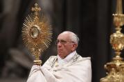 Pope Francis leads the Benediction following eucharistic adoration in St. Peter's Basilica at the Vatican June 2. Catholics gathered at the same time for eucharistic adoration in cathedrals and parishes around the world for the first Vatican-organized global holy hour. (CNS photo/Paul Haring)