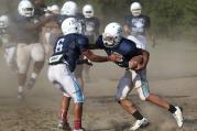 Player attempts to make tackle during football practice at Maryland Catholic high school. (CNS photo /Bob Roller)