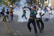 Demonstrators confront police during protests in Venezuela.