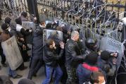Pro-Russia protesters scuffle with the police at the regional government building in Donetsk.