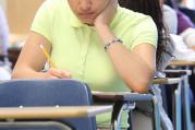 Giselle Ayala, 14, of Norcross, Ga., takes a diagnostic placement test at Cristo Rey Atlanta Jesuit High School Aug. 4. Some 160 first-year students took the placement exam at the newest Catholic high school in the community.