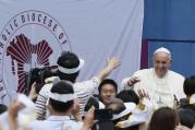 Pope Francis greets crowd as he arrives to World Cup Stadium in South Korea. (CNS photo/Paul Haring)