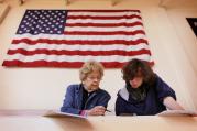 Beverly Moore helps her grandson Johnah Karman-Moore vote for the first time at Bellarmine University in Louisville, Ky., Nov. 4, during the midterm elections. (CNS photo/Mark Lyons, EPA)