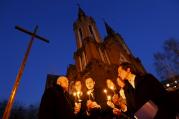 People light candles in front of a Catholic church during the Easter vigil in the Siberian city of Krasnoyarsk, Russia, April 4. (CNS photo/Ilya Naymushin, Reuters)