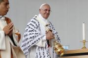 Pope Francis smiles at someone while using incense during Mass in Bicentennial Park in Quito, Ecuador, July 7. (CNS photo/Paul Haring) 