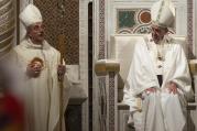 Pope Francis sits in the papal chair as he celebrates the ordination Mass of Bishop Angelo De Donatis, left, as an auxiliary bishop of Rome in the Basilica of St. John Lateran Nov. 9. (CNS photo/Claudio Peri, EPA)