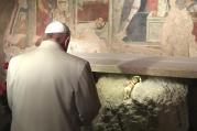 Pope Francis prays in front of a Nativity scene during a Jan. 4 surprise visit to the Franciscan shrine in Greccio, Italy. (CNS photo/L'Osservatore Romano, handout via EPA)