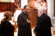 Bishop Edward K. Braxton of Belleville, Ill., greets the Rev. Timothy George, dean of Samford University's Beeson Divinity School. (CNS photo/Mary D. Dillard, One Voice)