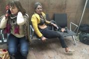 Injured people are seen at the scene of explosions at Zaventem airport near Brussels March 22. (CNS photo/Reuters, handout)