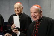 Cardinal Lorenzo Baldisseri, general secretary of the Synod of Bishops, and Austrian Cardinal Christoph Schonborn, holds a copy of Pope Francis' apostolic exhortation on the family, "Amoris Laetitia" ("The Joy of Love"), during a news conference for the document's release at the Vatican April 8, 2016. The exhortation is the concluding document of the 2014 and 2015 synods of bishops on the family. (CNS photo/Paul Haring)