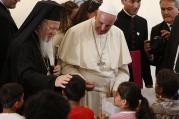  Ecumenical Patriarch Bartholomew of Constantinople and Pope Francis meet children at the Moria refugee camp on the island of Lesbos, Greece, April 16, 2016. (CNS photo/Paul Haring) 