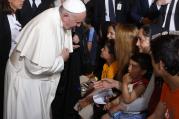 Pope Francis greets a Muslim woman as he meets refugees at the Moria refugee camp on the island of Lesbos, Greece, April 16, 2016. The pope put his hand over his heart and bowed when meeting Muslim women. (CNS photo/Paul Haring) 