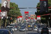 Photographs of Albanian priests killed during the former communist regime hang in the main boulevard of Tirana, Albania, Sept. 17, 2014. (CNS photo/Armando Babani, EPA)