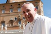 Pope Francis smiles as he arrives to lead his general audience in St. Peter's Square at the Vatican on May 18. (CNS photo/Paul Haring)