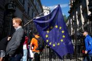 A man carries a European Union flag in London on June 24, a day after voters in the United Kingdom decided to leave the EU. (CNS photo/Neil Hall, Reuters) 