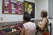 Women look at relics and other items of Blessed Oscar Romero at Divine Providence Hospital in San Salvador March 22, 2015. (CNS photo/Octavio Duran)