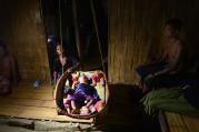 A Bru refugee family is seen in Kanchanpur, India on June 18. (CNS photo/Stringer, EPA)