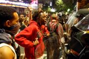 A man confronts riot police during Sept. 21 protests in Charlotte, N.C., after police fatally shot Keith Lamont Scott in the parking lot of an apartment complex. (CNS photo/Jason Miczek, Reuters)