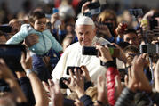 People take photos on smartphones as Pope Francis greets the crowd during his general audience in St. Peter's Square at the Vatican Oct. 12. (CNS photo/Paul Haring) 