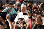 People take photos on smartphones as Pope Francis greets the crowd during his general audience in St. Peter's Square at the Vatican Oct. 12. The pope called for an immediate cease-fire in Syria so that civilians can be rescued. (CNS photo/Paul Haring)