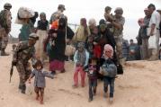 Syrian refugees arrive at a camp after crossing into the Jordanian side of the northeast Jordan-Syria border near Royashed. (CNS photo/Jamal Nasrallah, EPA)