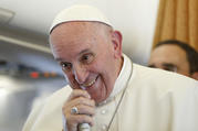 Pope Francis answers questions from journalists aboard his flight from Malmo, Sweden, to Rome Nov. 1. (CNS photo/Paul Haring) 