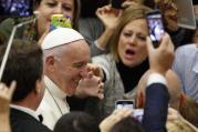 Pope Francis arrives to lead his general audience in Paul VI hall at the Vatican Nov. 23. (CNS photo/Paul Haring)