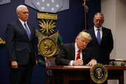 U.S. President Donald Trump signs a revised executive order for a U.S. travel ban on March 6 at the Pentagon in Arlington, Va. (CNS photo/Carlos Barria, Reuters)