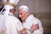 Pope Francis greets retired Pope Benedict XVI in a 2015 file photo. (CNS photo/Maurizio Brambatti, EPA) 