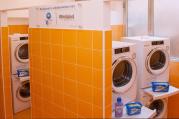 Six brand new washers and dryers donated by Whirlpool are featured at the Pope Francis Laundry facility in Rome, a new laundromat opened April 10 by the Papal Almoner's Office for the city's homeless. (CNS photo/courtesy of the Papal Almoner's Office) 
