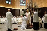 Bishop R. Walker Nickless of Sioux City, Iowa, lays hands on Deacon Andy Galles during his ordination into the priesthood on June 3 at the Cathedral of the Epiphany in Sioux City. (CNS photo/Jerry L Mennenga)