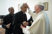 Salesian Father Tom Uzhunnalil, who was released on Sept. 12 after having been kidnapped 18 months ago in Yemen, is anointed by Pope Francis during a Sept. 13 meeting at the Vatican. (CNS photo/L'Osservatore Romano)