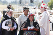 Indigenous people walk past Pope Francis after presenting offertory gifts during the pope's celebration of Mass at the Maquehue Airport near Temuco, Chile, Jan. 17. (CNS photo/Paul Haring)
